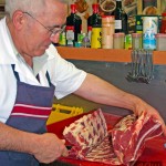 Butcher removing fillet off the bone